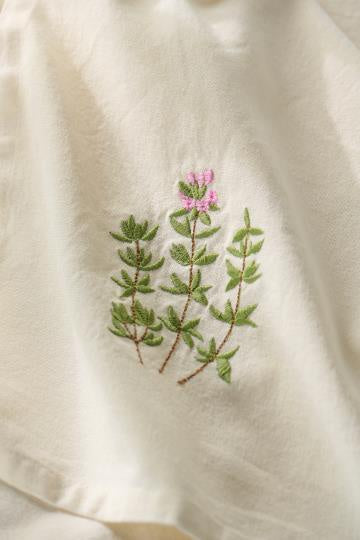 Theedoek geborduurde bloem roze groen